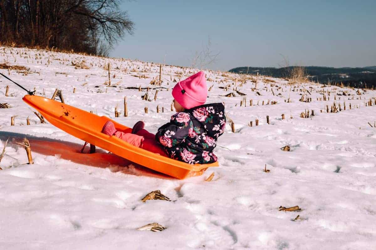 snow day sledding with kids