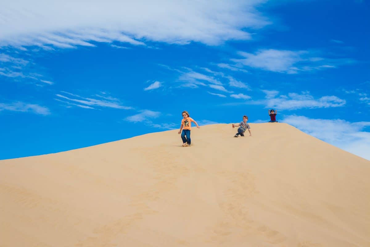 exploring the sand dunes with kids