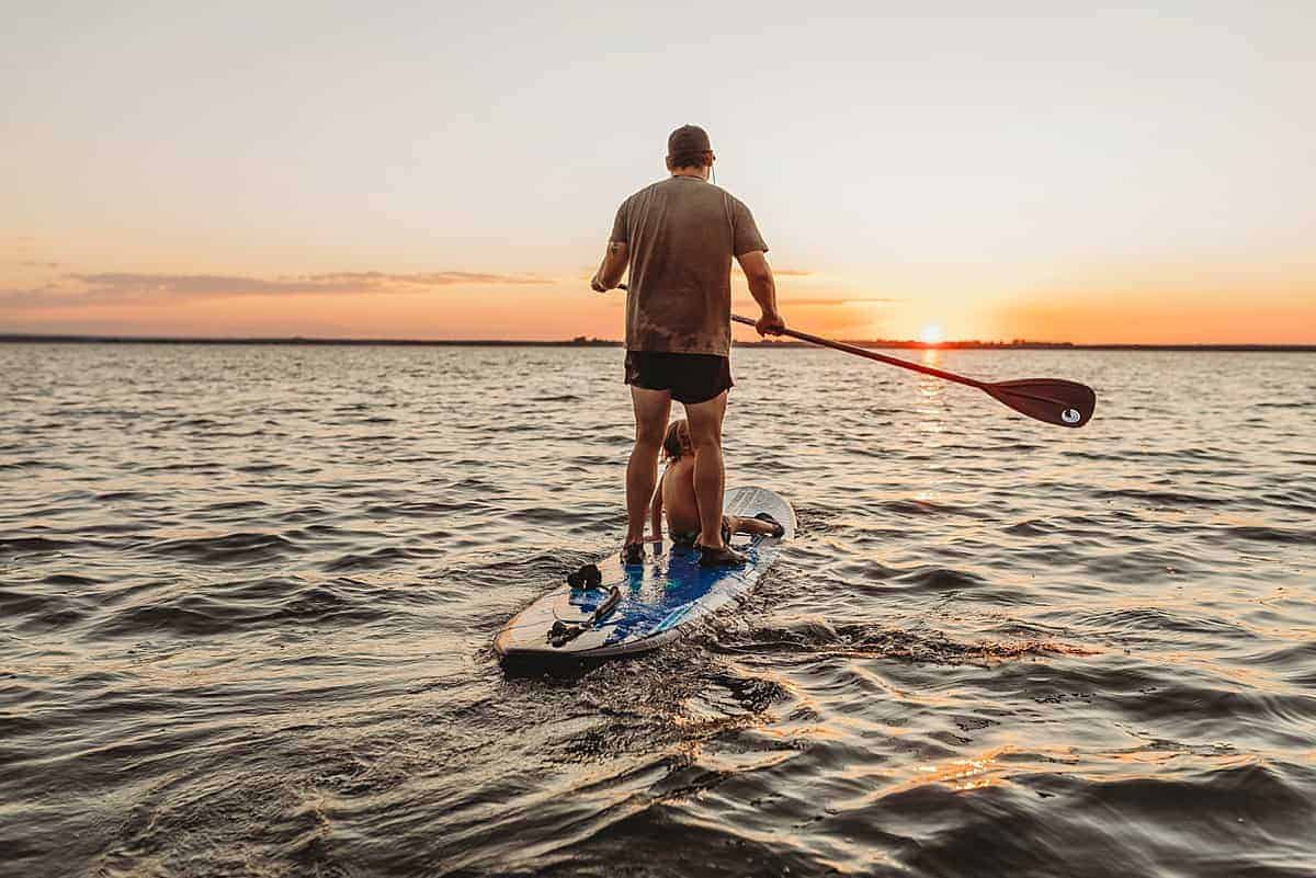 teaching kids to stand up paddle boarding - best outdoor water sports for kids