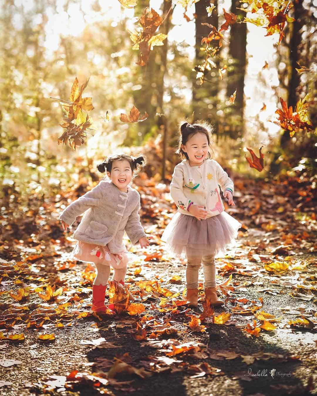 outdoor activities for kids in the fall - play in the leaves