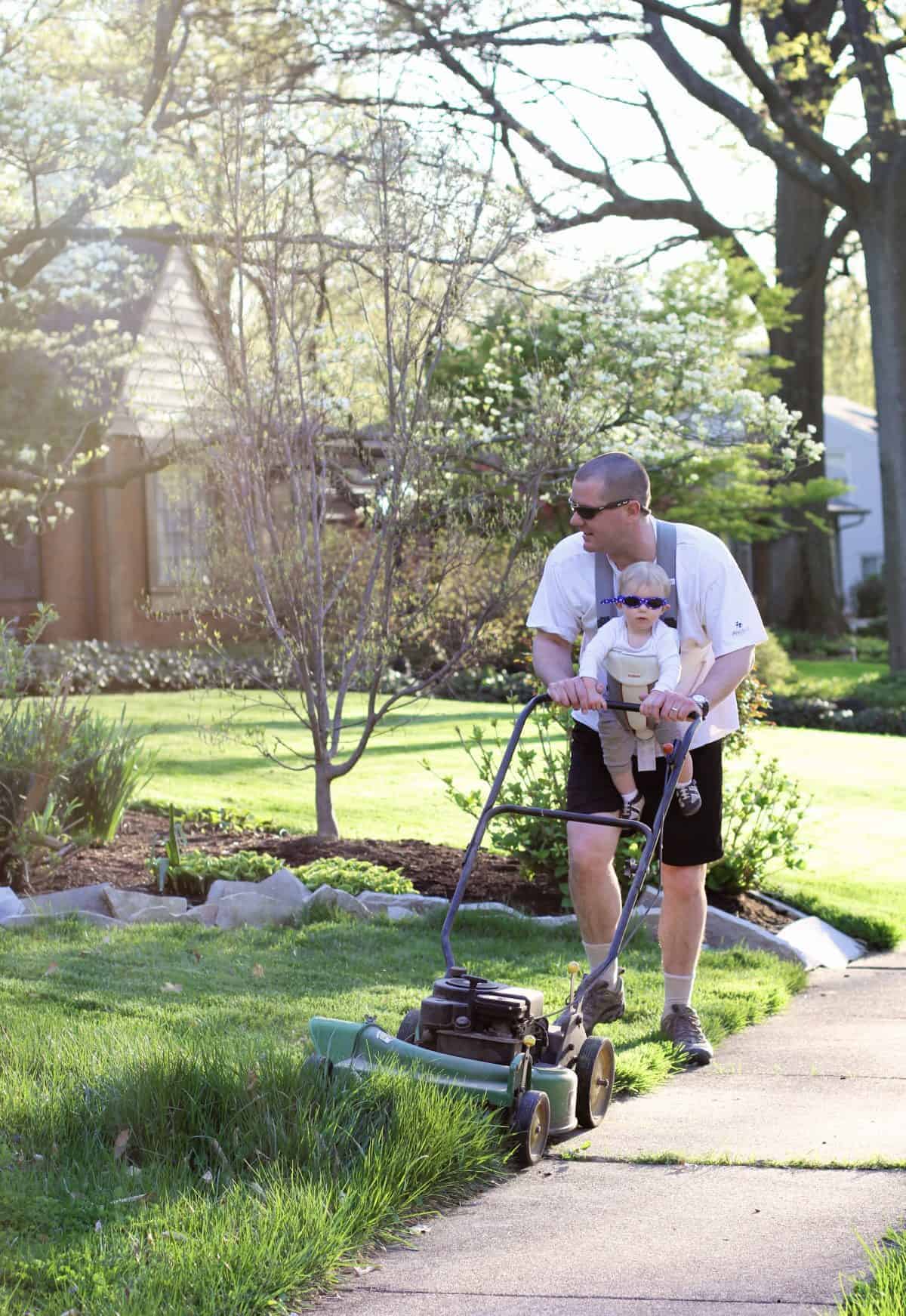 mowing the lawn with baby - protective eyewear for babies