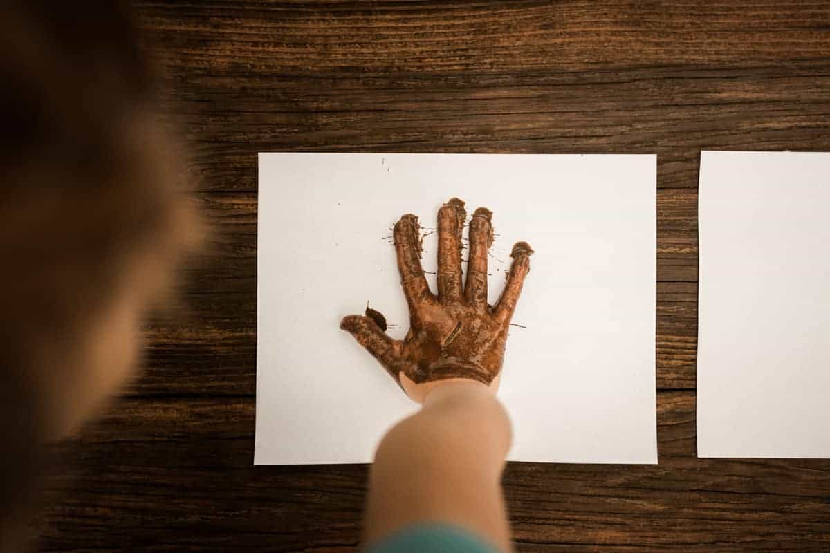 Muddy Hand Print - mud art projects for kids