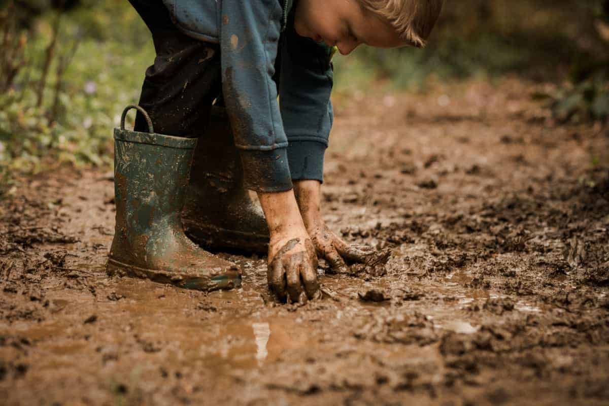 Kids Playing In The Mud