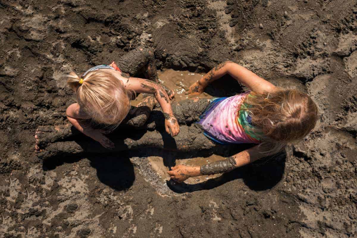 kids playing in the mud