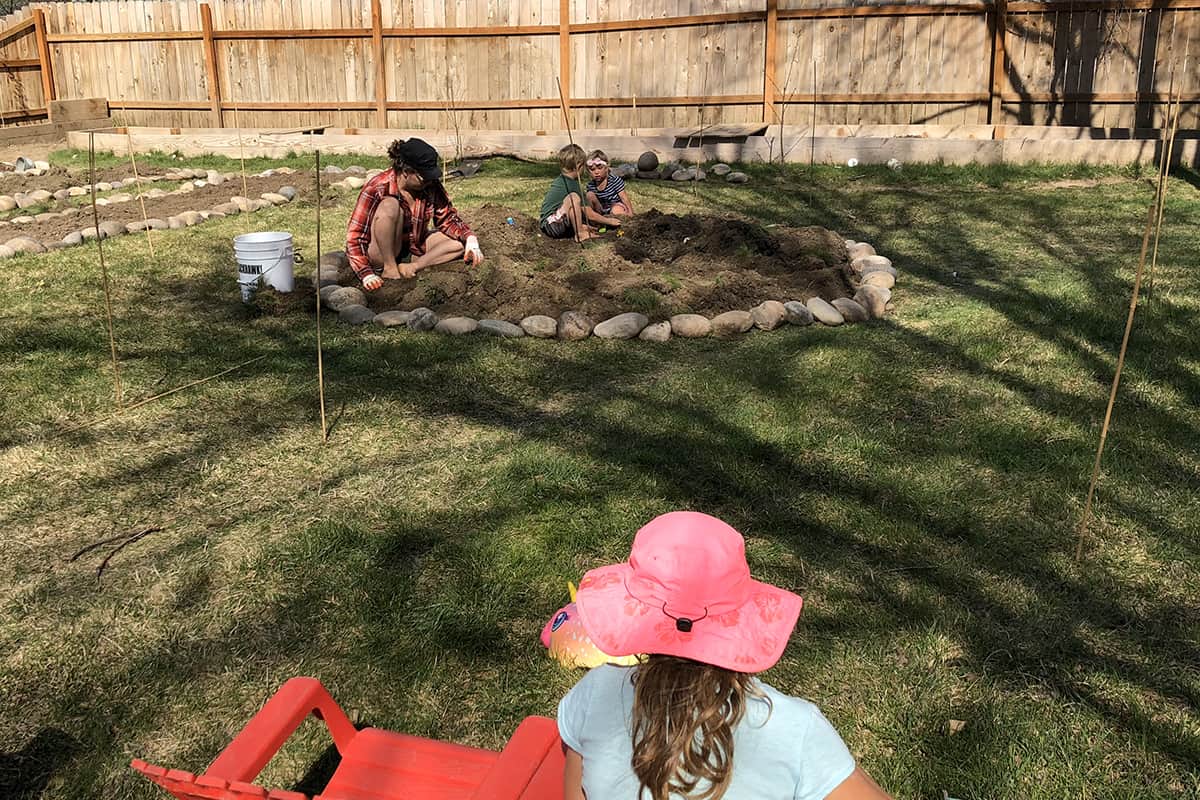 Teaching kids where their food comes from - planting garden