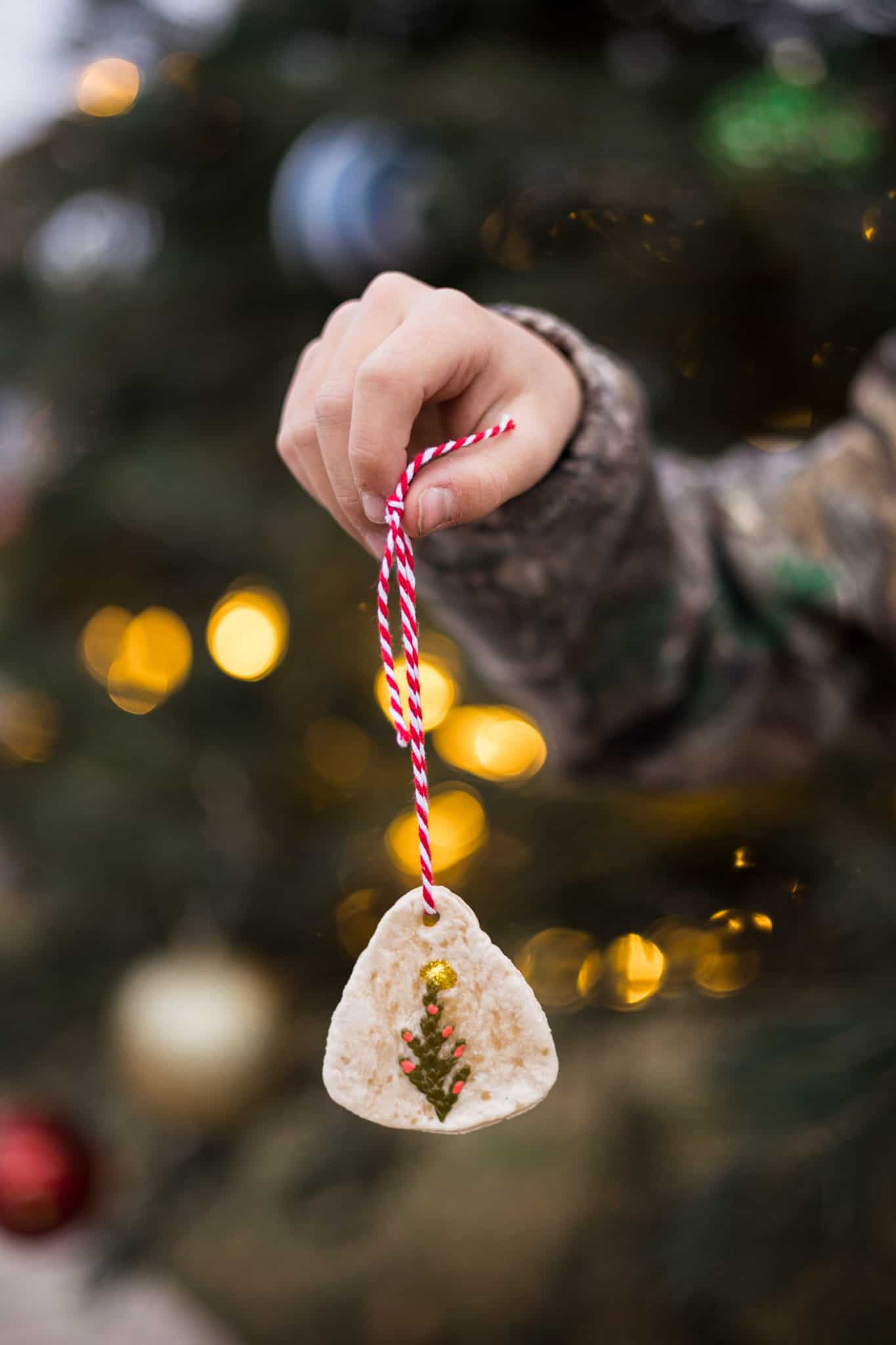 Holiday salt dough tree ornaments with pine and red string