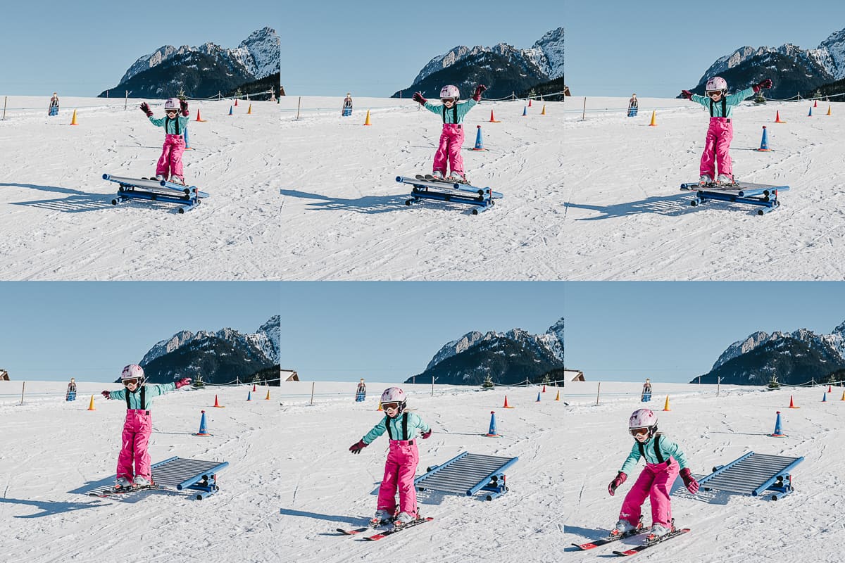 a child learns to downhill ski at the nursery slops