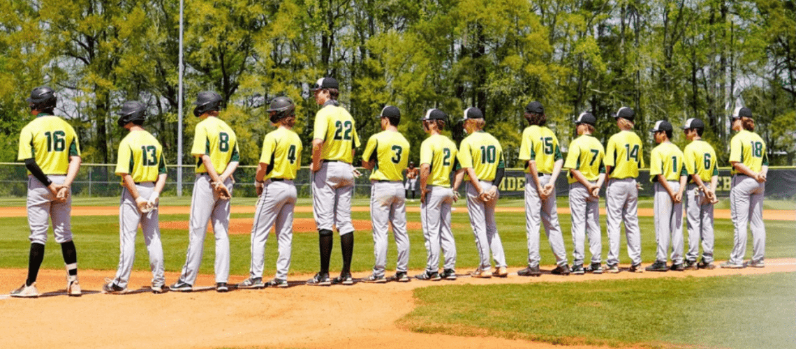 high school baseball team lined up prior to the start of the game