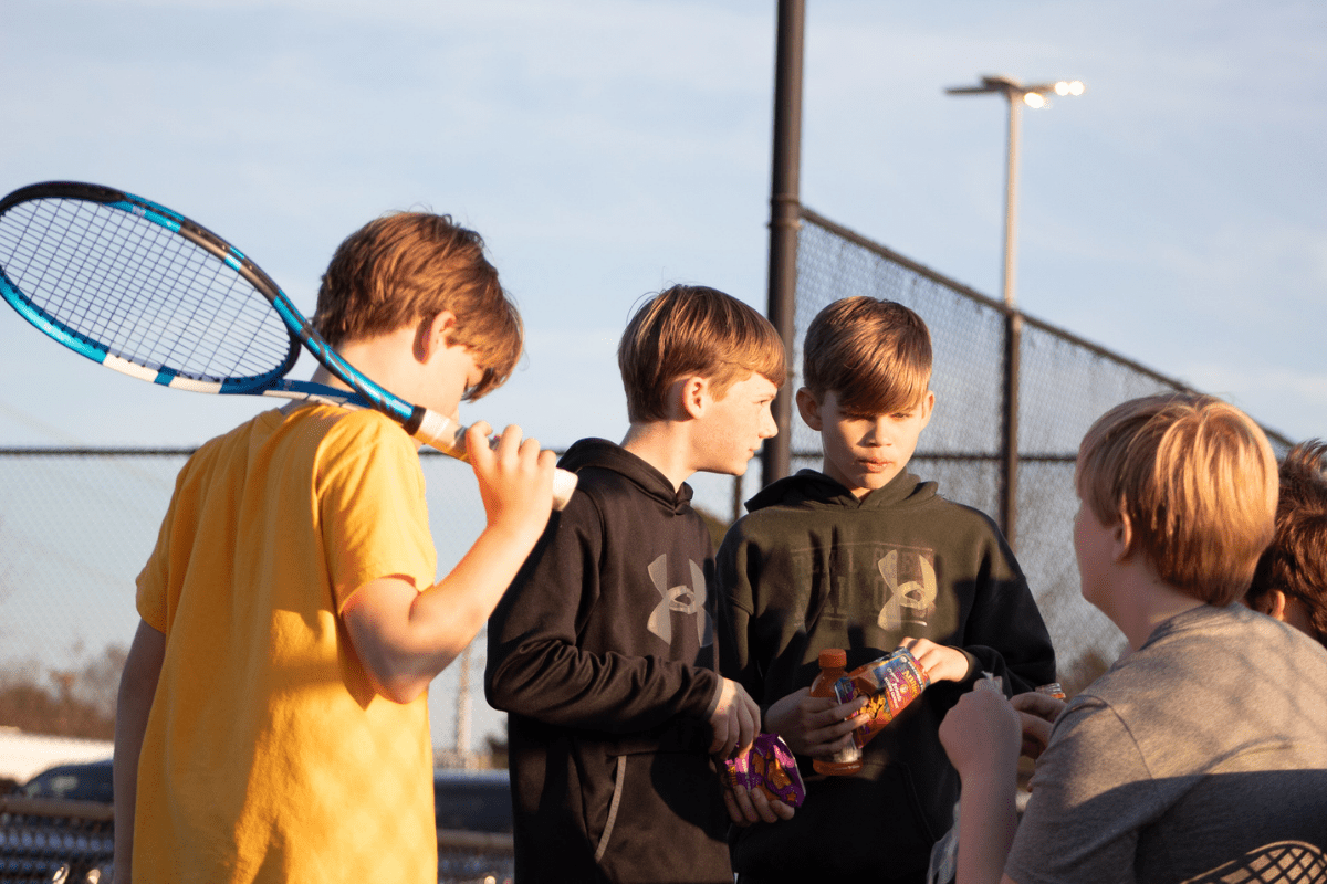 boys snack break at tennis match