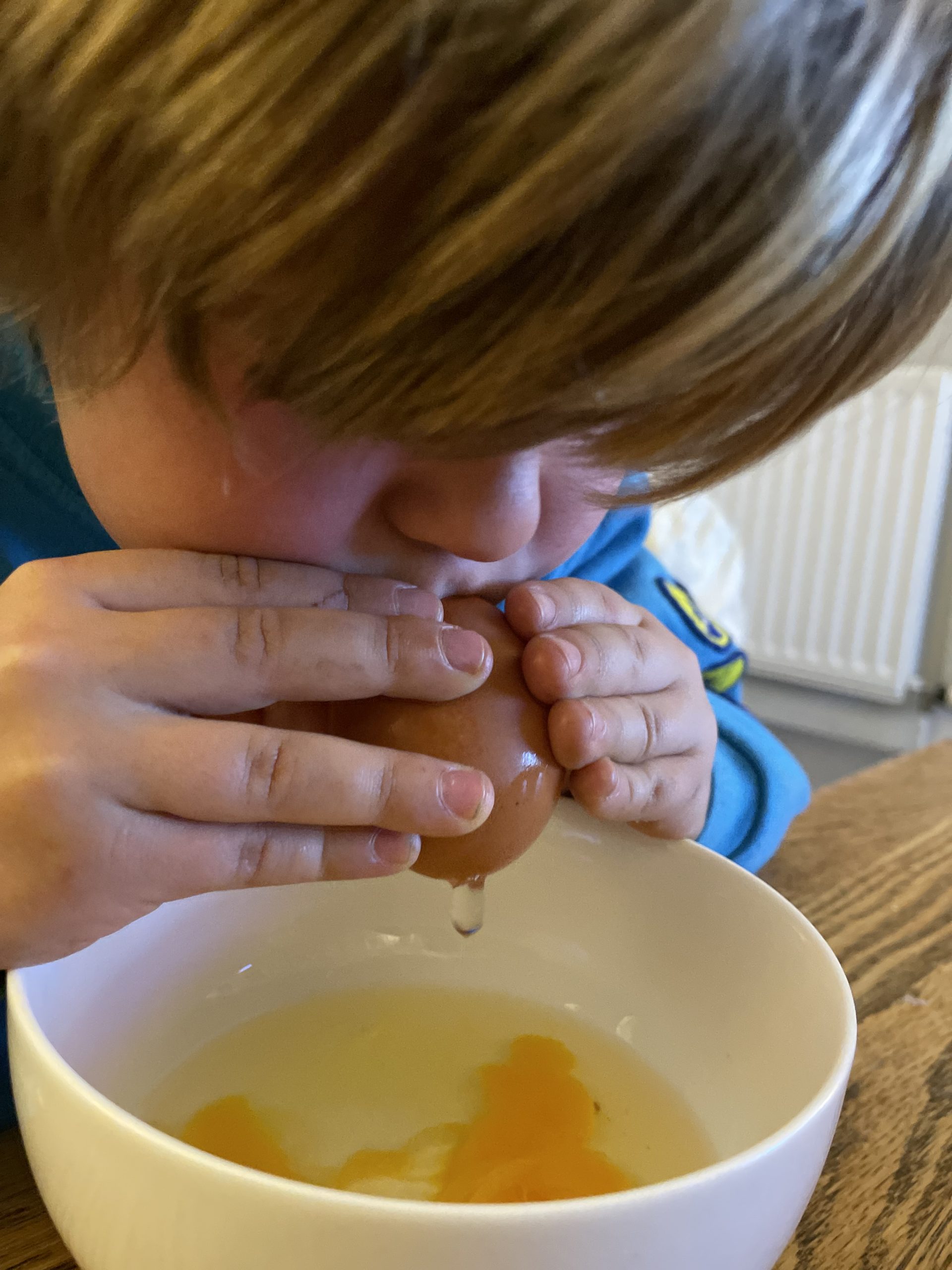 Children blowing eggs