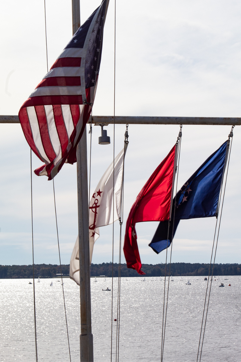 American flag and sailing flags in the wind