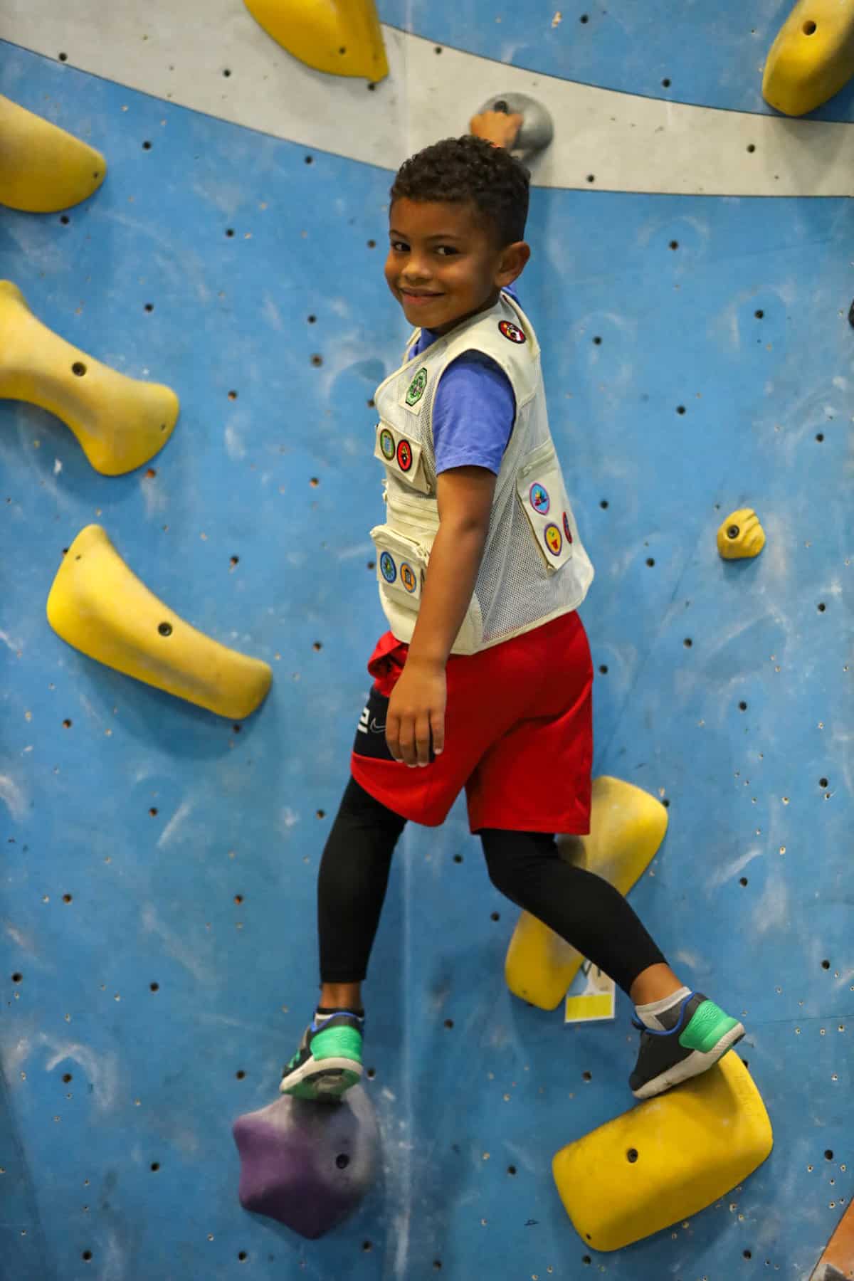 young climber bouldering