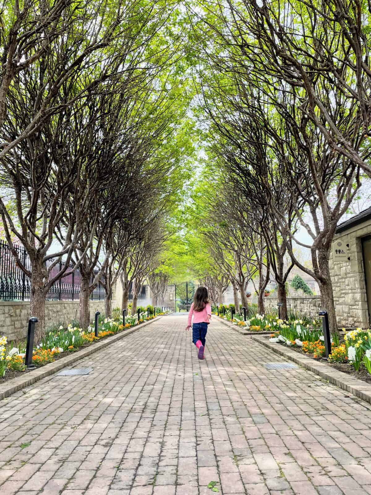 child running through the Kauffman Memorial Gardens Kansas City Missouri