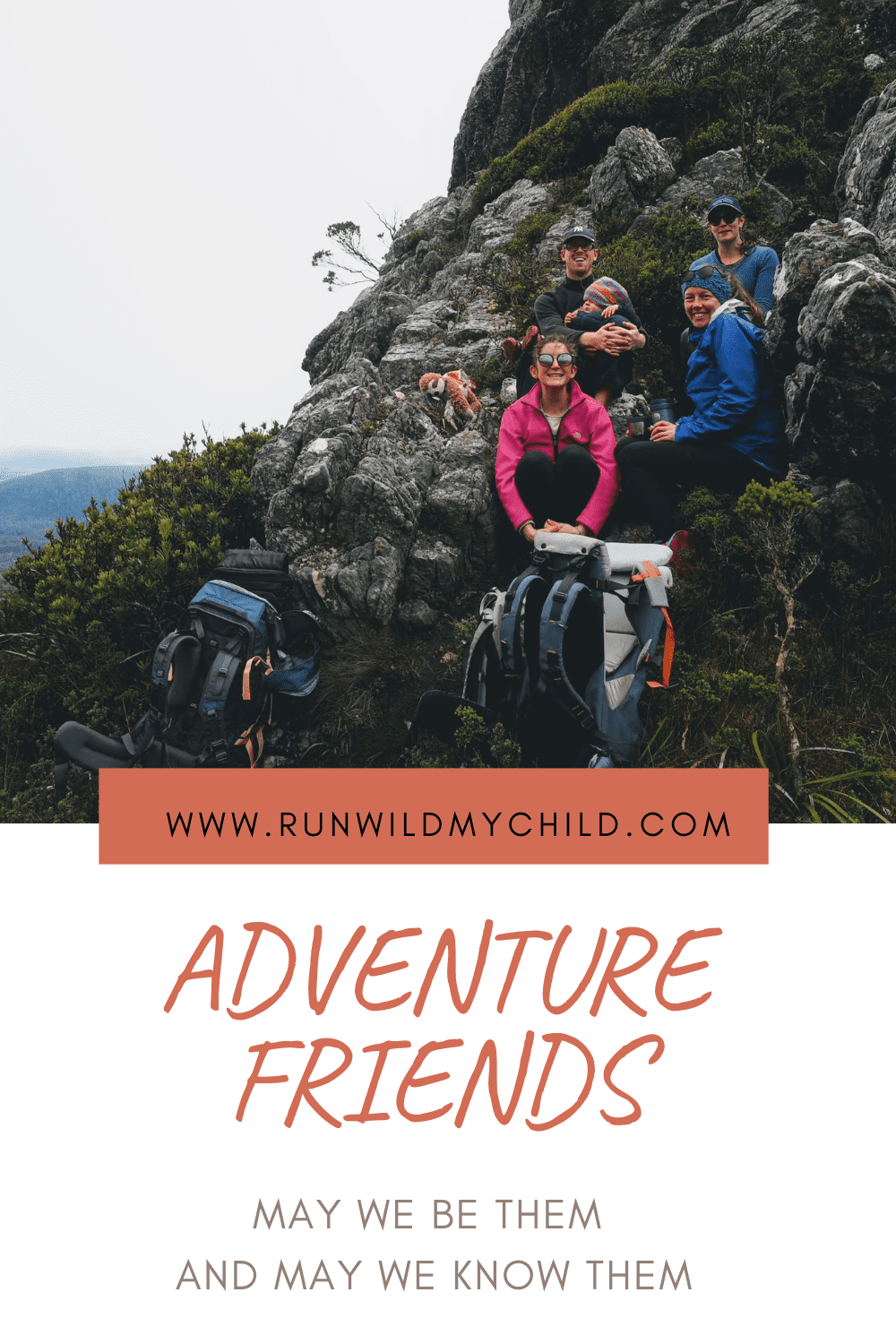 Friends resting on mountain while hiking with a baby carrier backpack. 