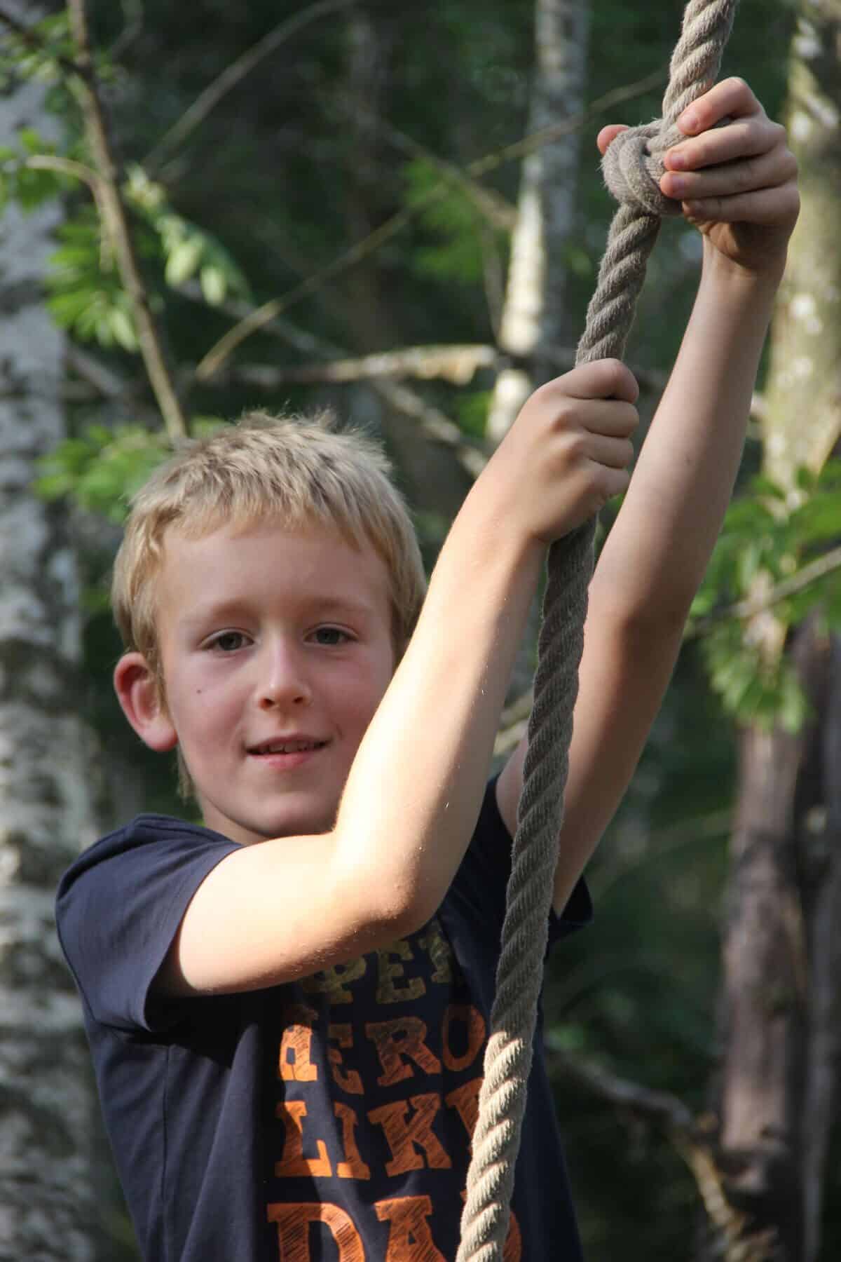 a boy on a rope