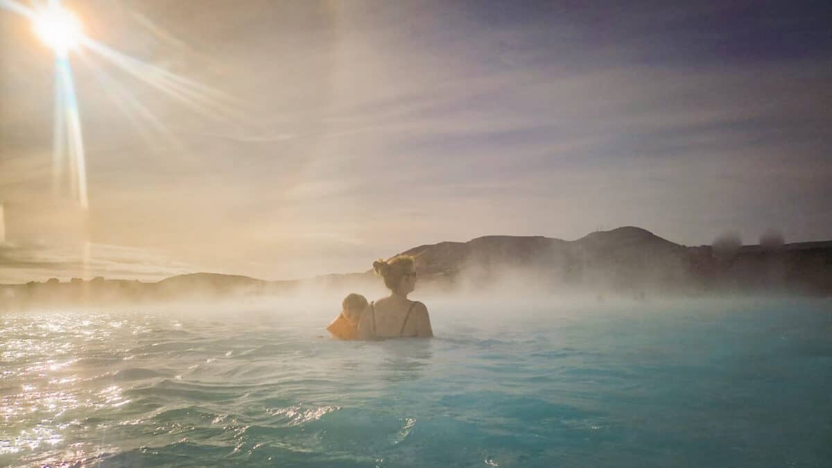 Swimming in blue lagoon natural pool Iceland