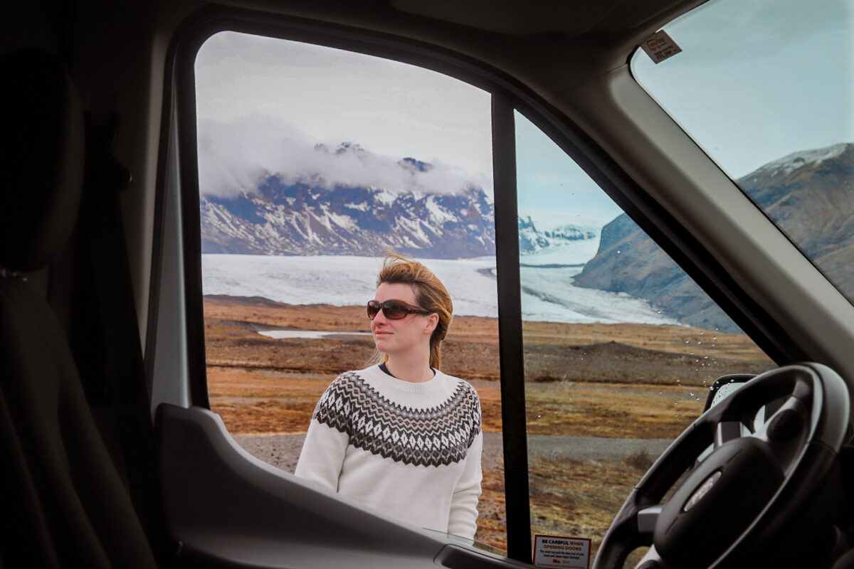 Woman with campervan in iceland