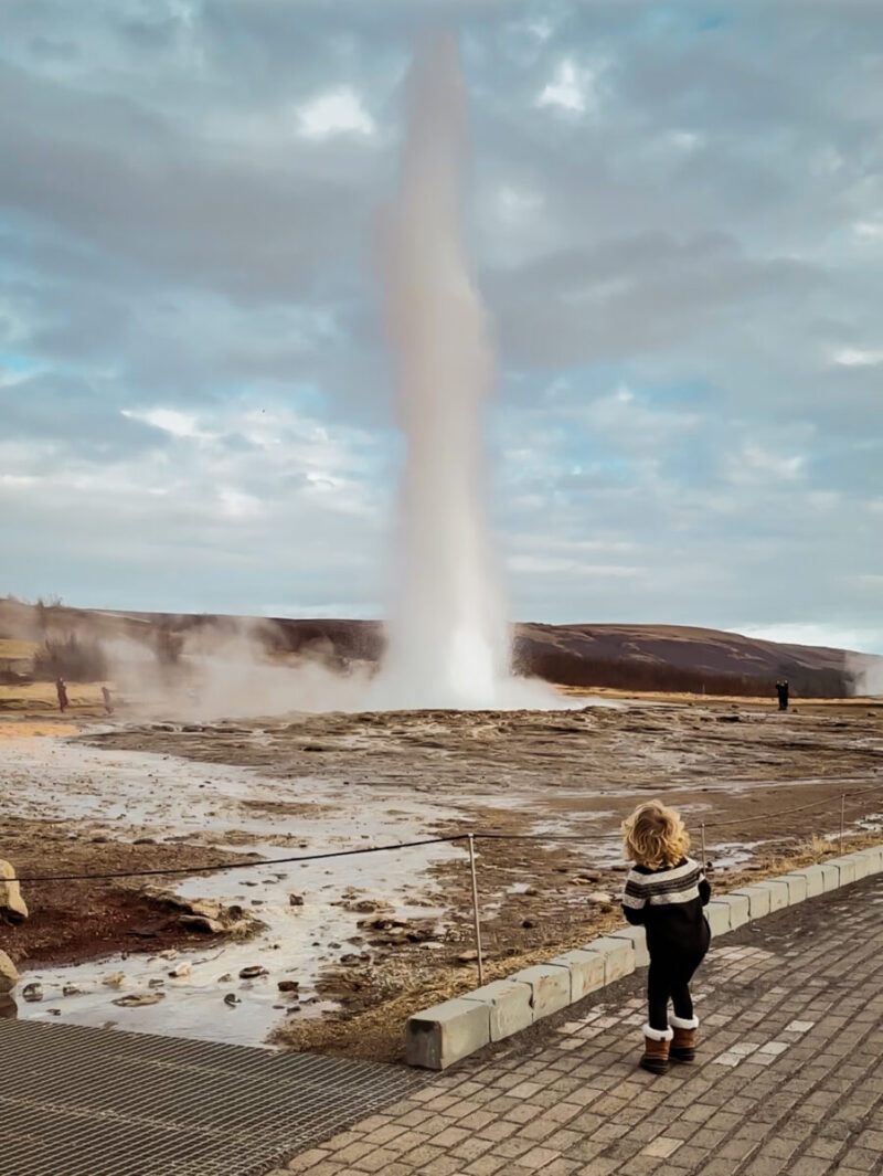Geyser in Iceland with child