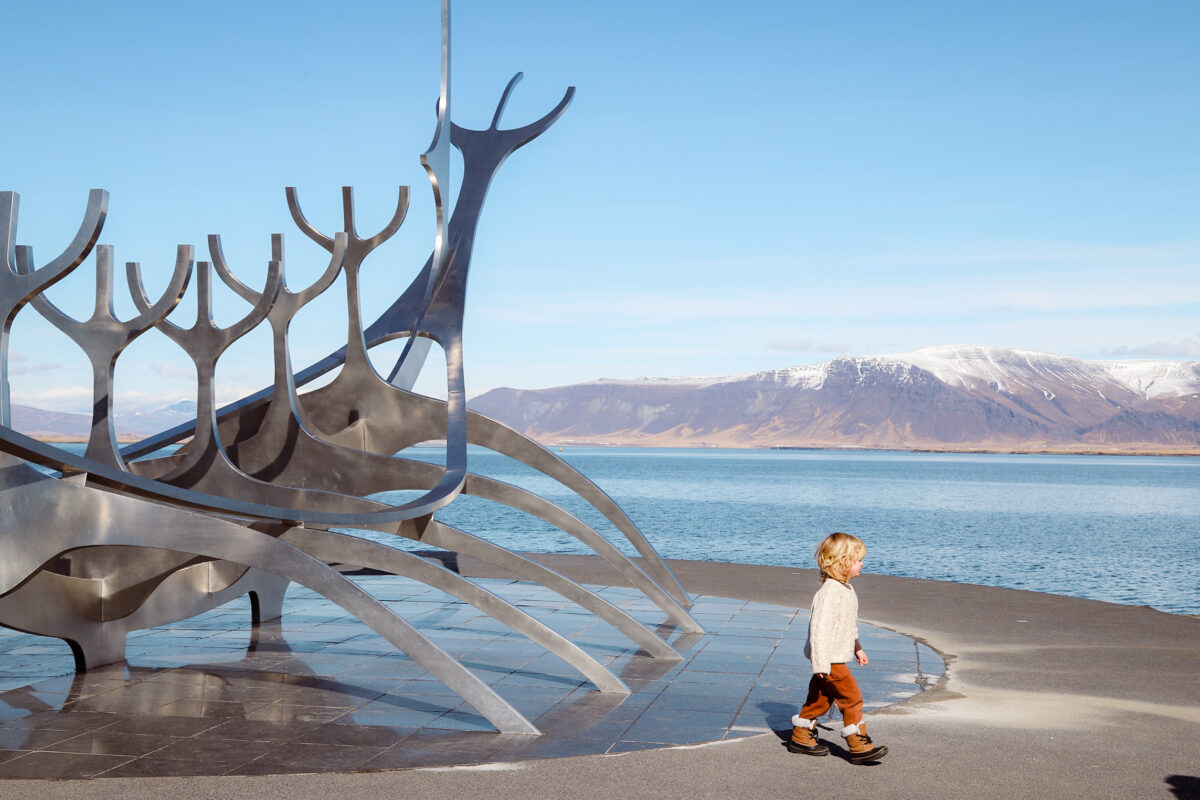 Child with sun voyager in Reykjavik Iceland