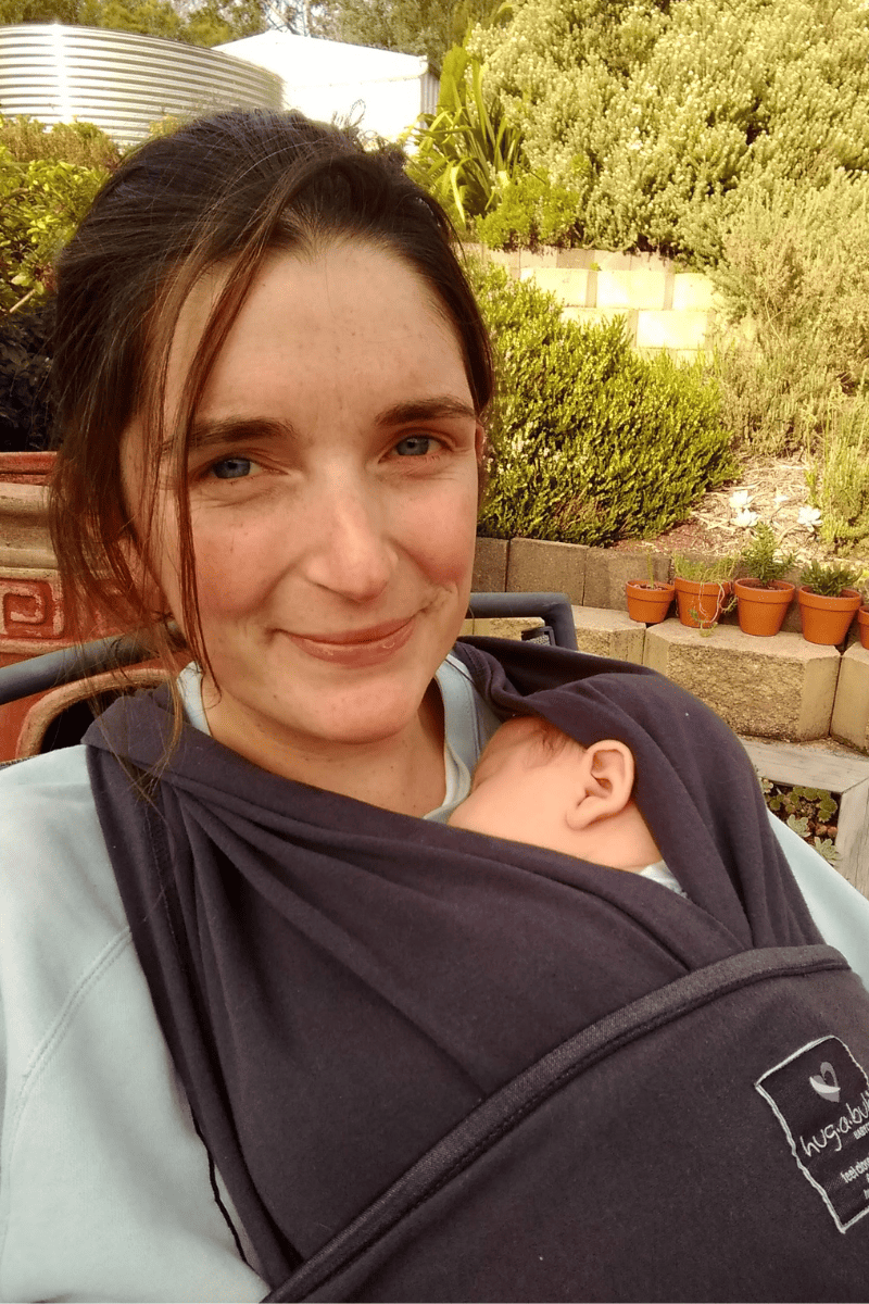 Mother with baby in a wrap carrier