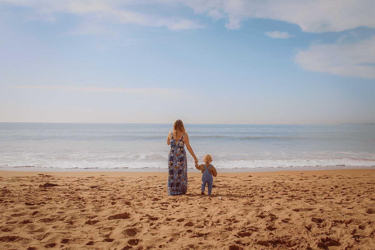 Family on Bournemouth Beach, UK - Best beaches for kids in Southern England