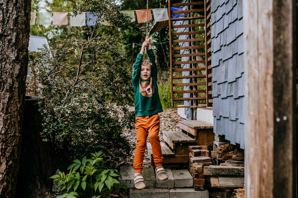 Climbing and swinging help build trunk strength and are fun backyard garden activities to include when gardening with kids.