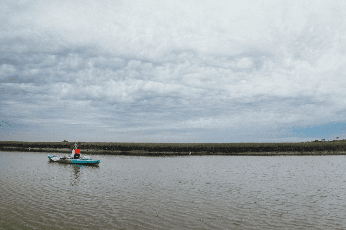 a teen daughter in a kayak on the Kiawah River