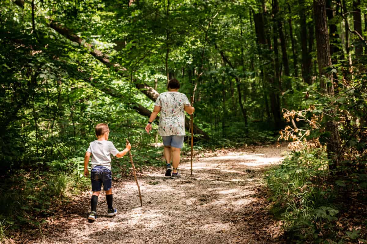 having conversations while walking or hiking helps kids build communication skills and deepens family bonds