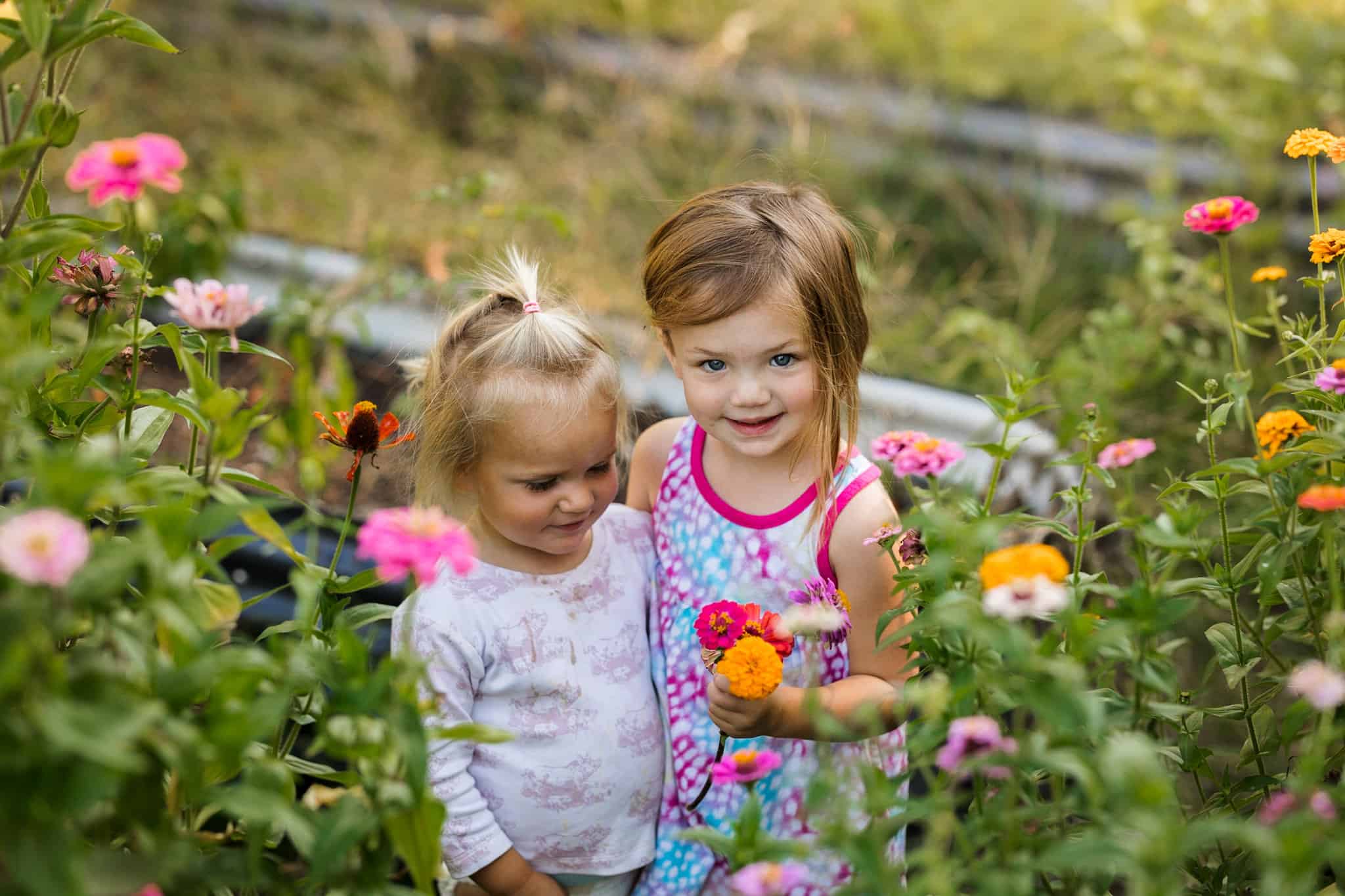 Cut flower garden with two little girls 