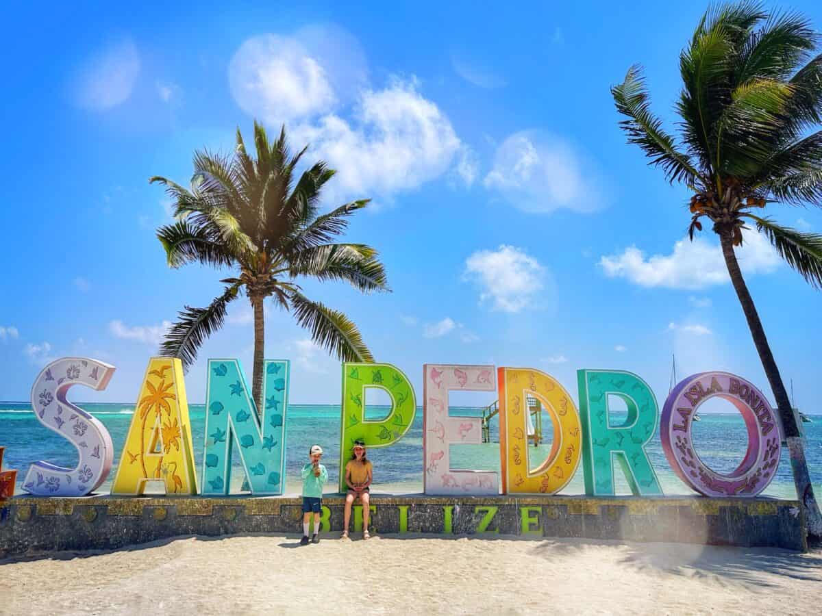 kids at the San Pedro sign in Belize