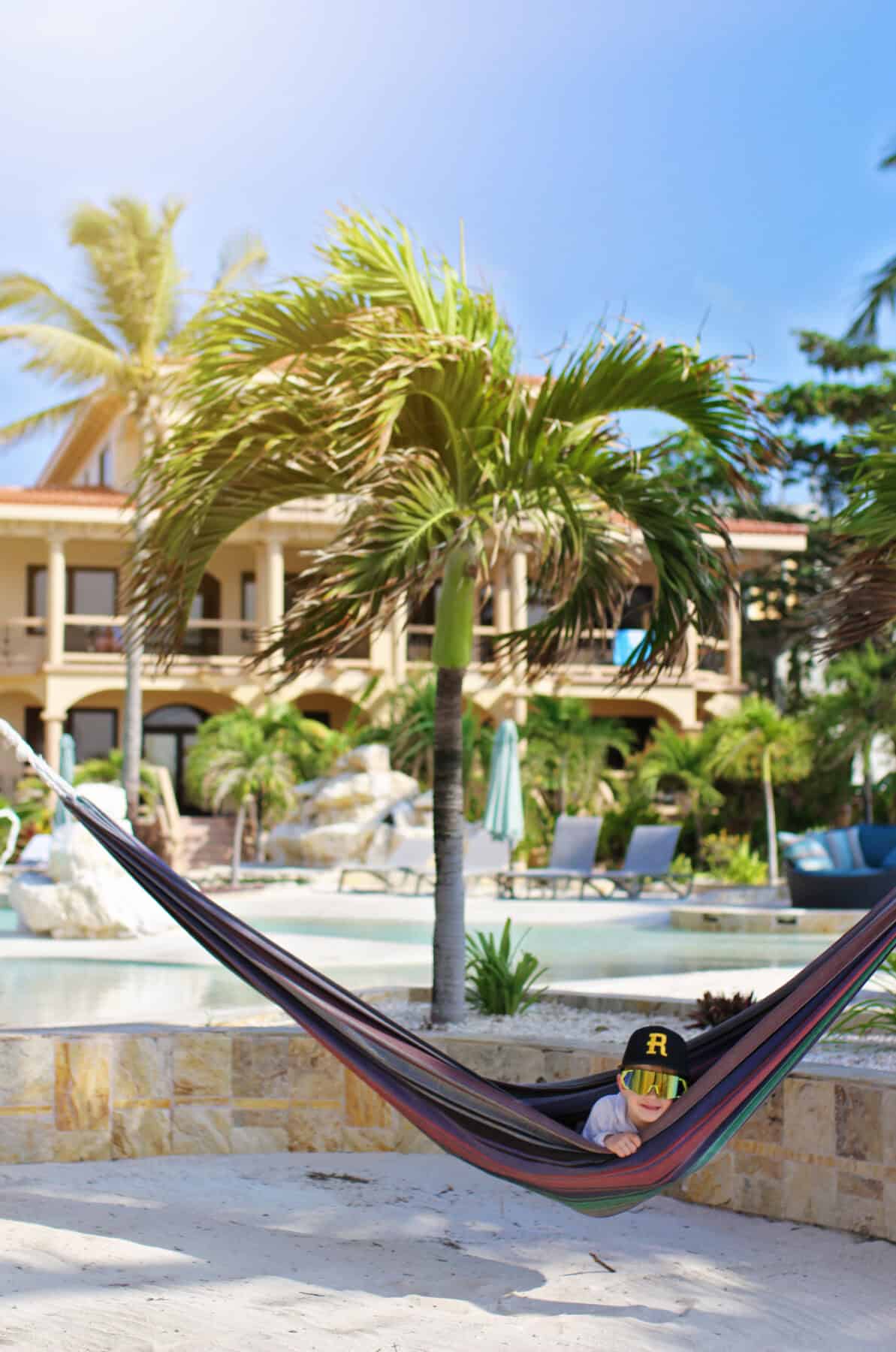 boy in hammock at Coco Beach Resort - Ambergris Caye Belize