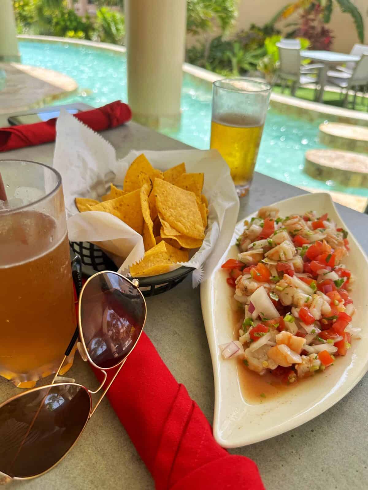 Poolside food and drinks at Coco Beach Resort Belize - shrimp ceviche and beer