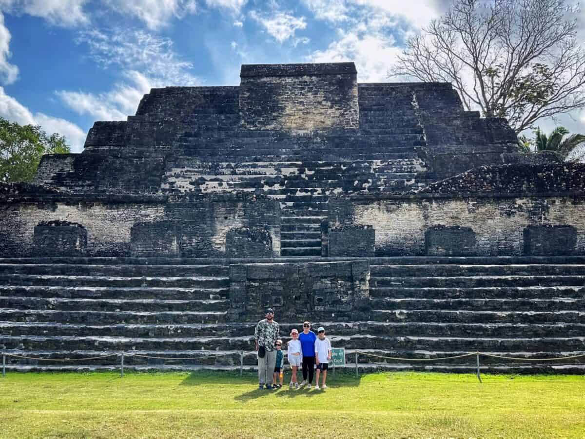Family standing in front of Altun Ha ancient mayan ruins in Belize