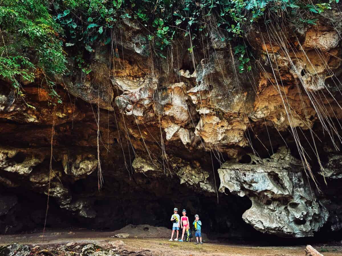 kids standing in front of cave in Belize
